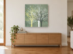 Three Bare Trees landscape canvas print on the wall of a living room above a sideboard