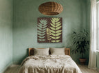 Three Fronds on Chocolate floral canvas print on the wall of a bedroom