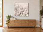 Bare Branch Canopy landscape canvas print on the wall of a living room above a sideboard