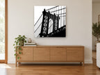 Manhattan Bridge Silhouette city canvas print on the wall of a living room above a sideboard