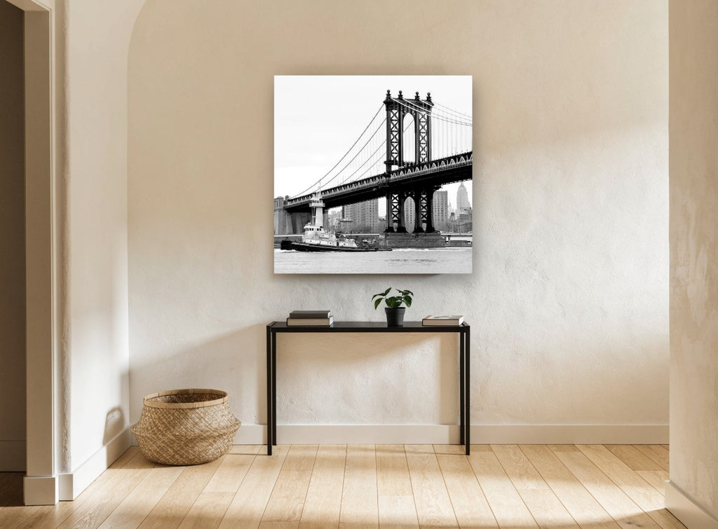 Tug Under the Bridge city canvas print on the wall of a hallway