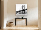 Tug Under the Bridge city canvas print on the wall of a hallway