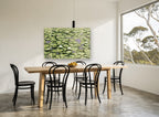 Lily Pad Pond landscape canvas print on the wall of a dining room