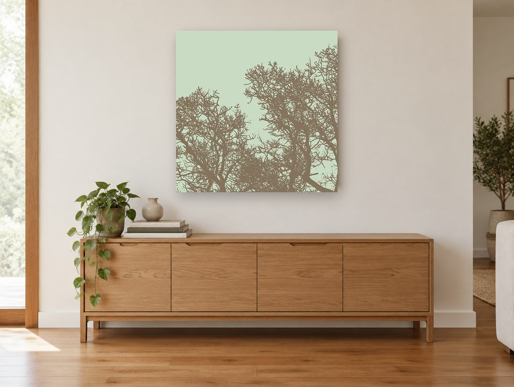 Mocha Twigs Mint Sky landscape canvas print on the wall of a living room above a sideboard