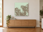 Mocha Twigs Mint Sky landscape canvas print on the wall of a living room above a sideboard