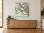 Bare Branch Silhouette landscape canvas print on the wall of a living room above a sideboard