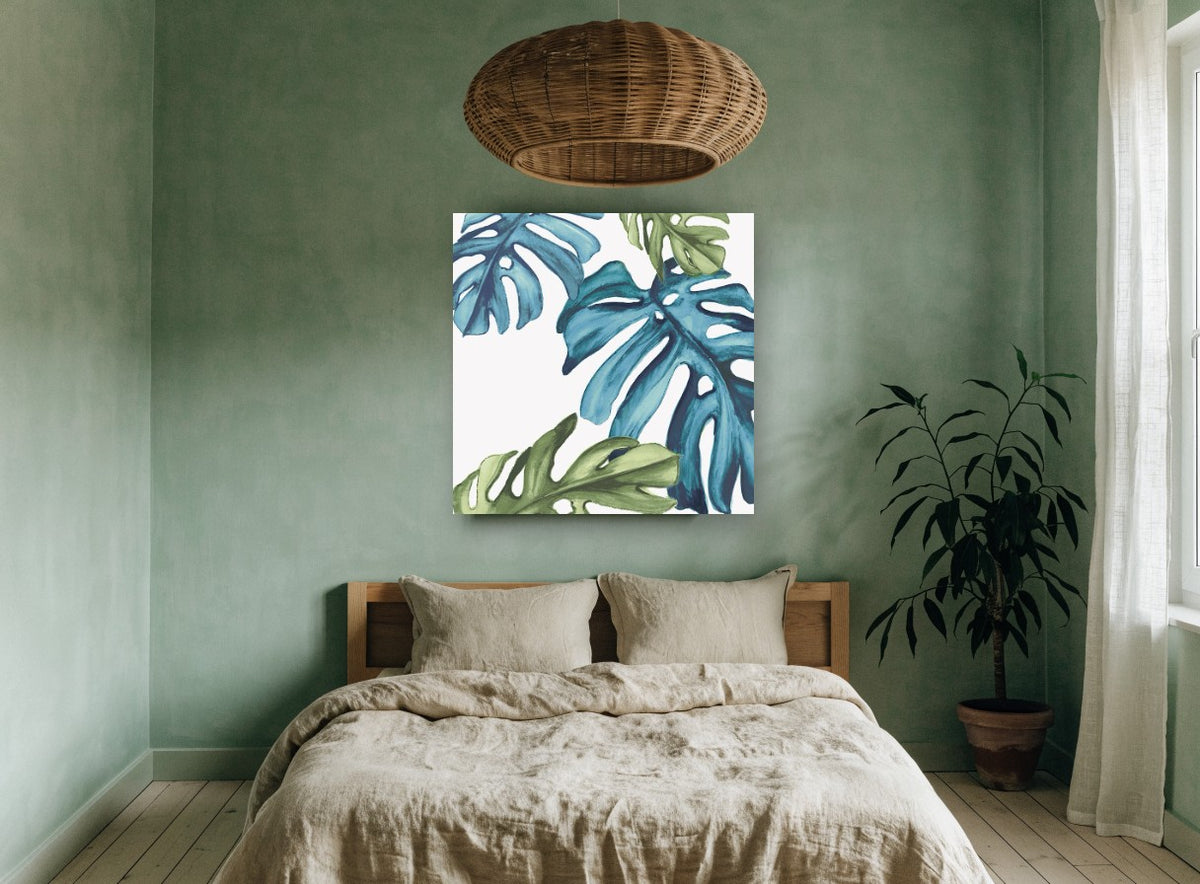 Teal Monstera Drift floral canvas print on the wall of a bedroom