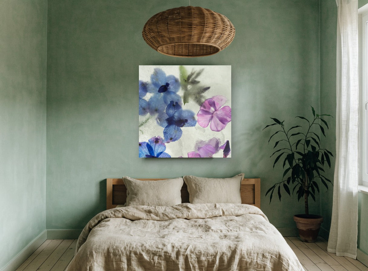 Blue Blooms in Ice floral canvas print on the wall of a bedroom