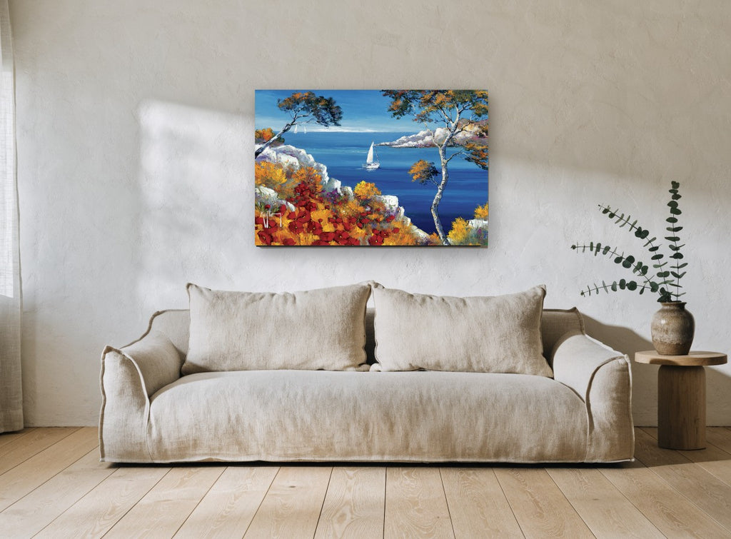Poppy Cliff Sailing Bay coastal canvas print on the wall of a living room