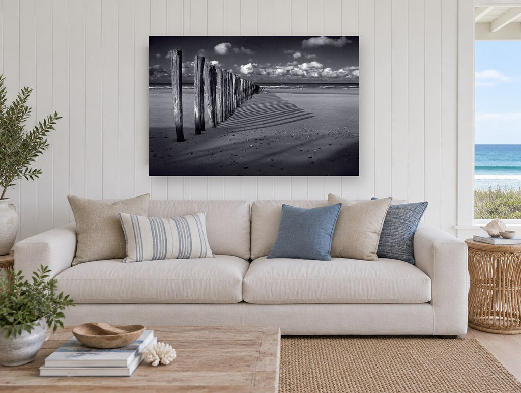Groyne Shadows at Low Tide coastal canvas print on the wall of a beach house living room