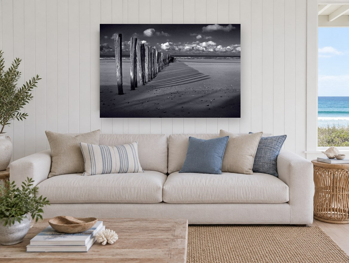 Groyne Shadows at Low Tide coastal canvas print on the wall of a beach house living room