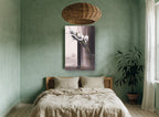 White Blooms Tall Vase floral canvas print on the wall of a bedroom