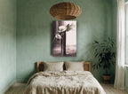 White Blooms in Dark Vase floral canvas print on the wall of a bedroom