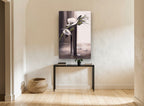 White Blooms in Dark Vase floral canvas print on the wall of a hallway