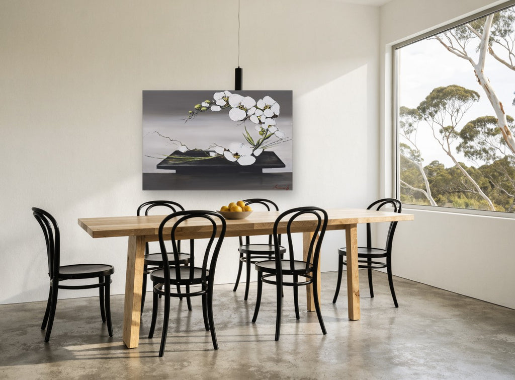 Orchid Arc on Black Tray floral canvas print on the wall of a dining room