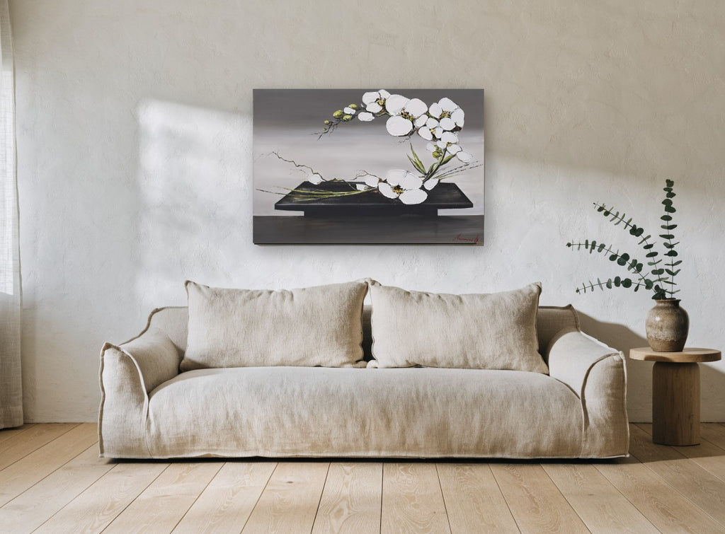 Orchid Arc on Black Tray floral canvas print on the wall of a living room