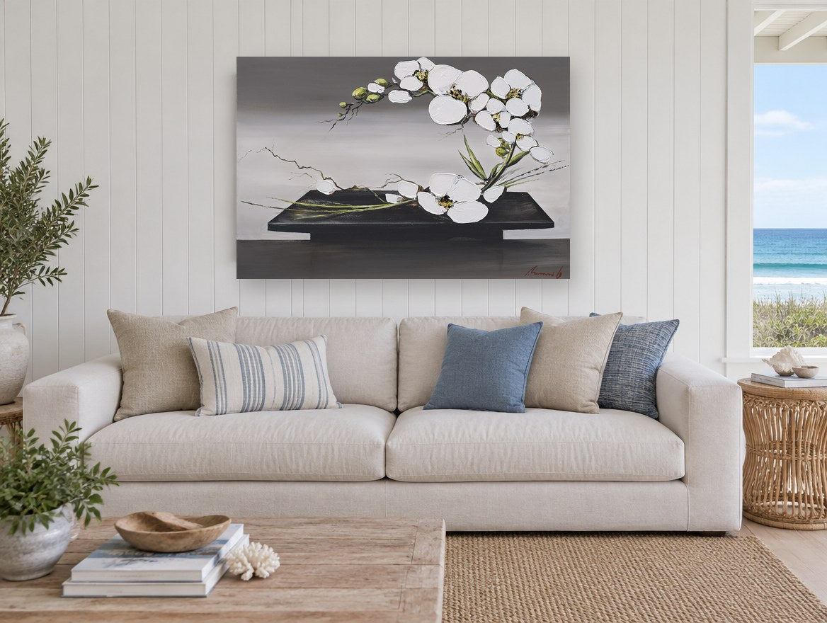 Orchid Arc on Black Tray floral canvas print on the wall of a beach house living room