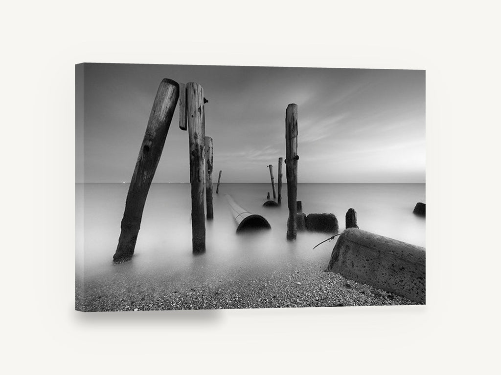 Silent Pilings at Dusk, weathered pilings black and white seascape, coastal canvas wall art print ready to hang
