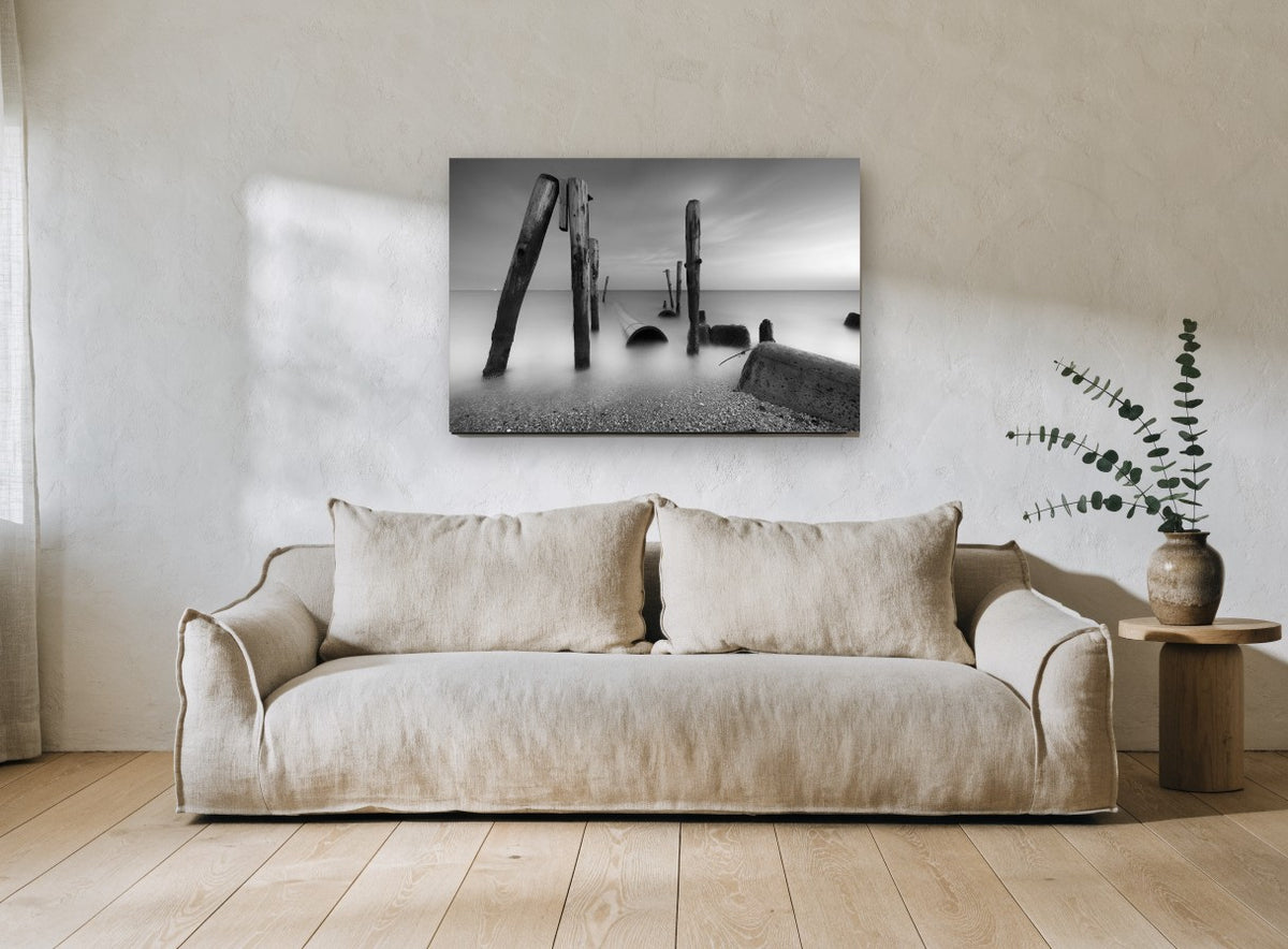 Silent Pilings at Dusk coastal canvas print on the wall of a living room