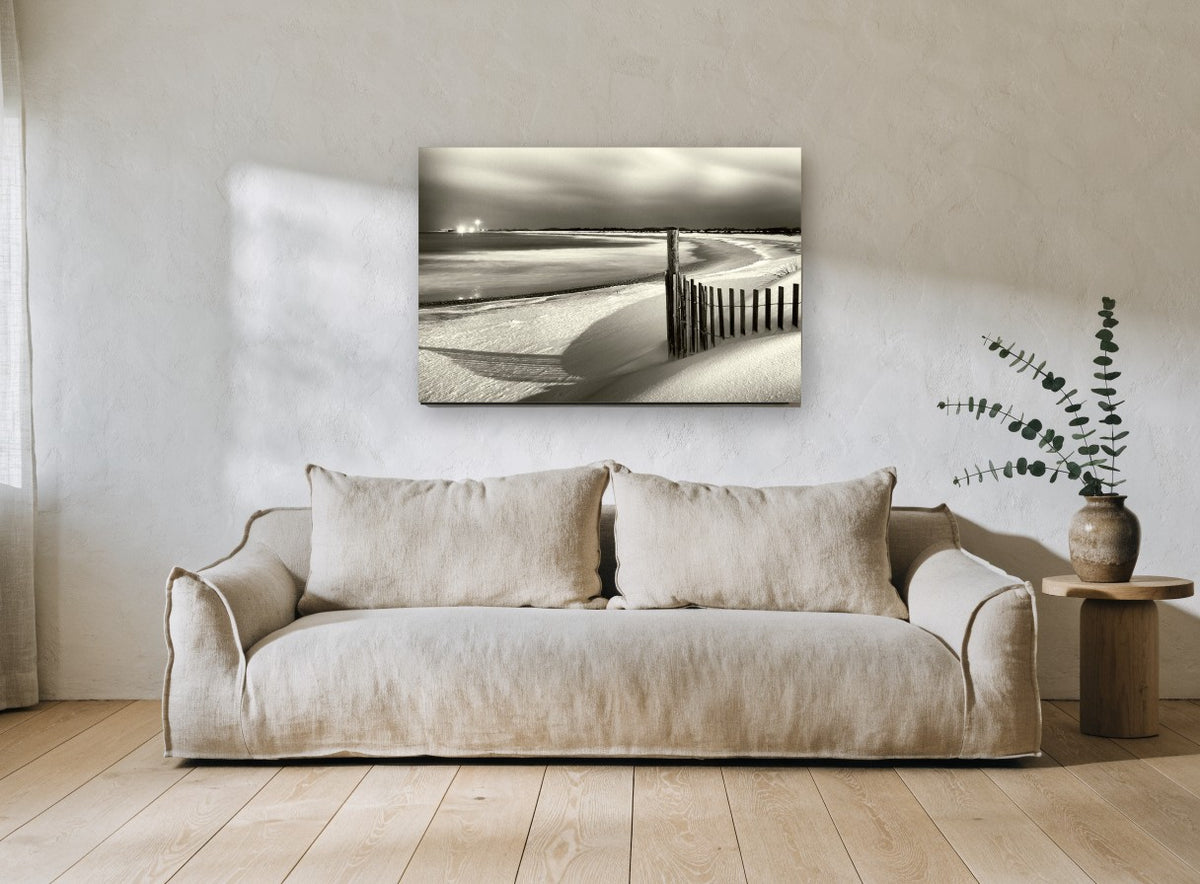 Moonlit Dune Fence coastal canvas print on the wall of a living room
