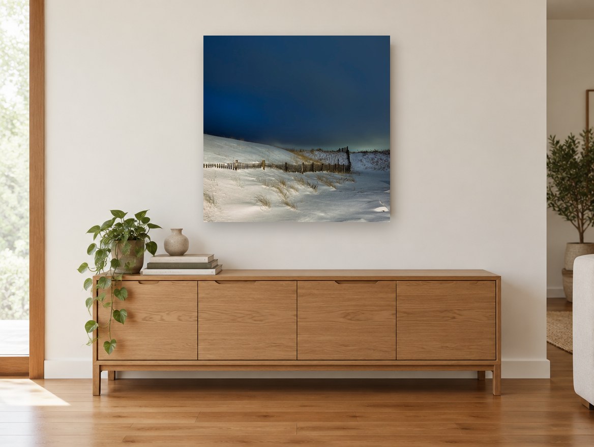 Snowbound Dune Fence coastal canvas print on the wall of a living room above a sideboard
