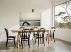 Driftwood Arch at Dusk coastal canvas print on the wall of a dining room