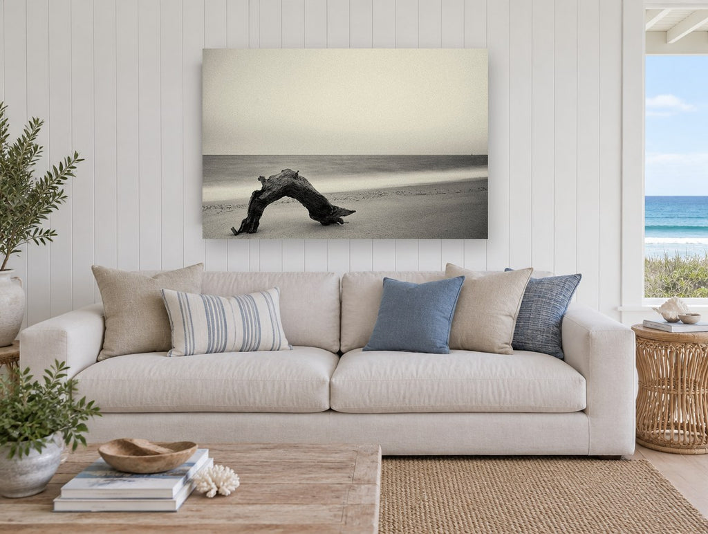 Driftwood Arch at Dusk coastal canvas print on the wall of a beach house living room