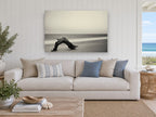 Driftwood Arch at Dusk coastal canvas print on the wall of a beach house living room