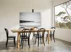 Pier in the Mist coastal canvas print on the wall of a dining room