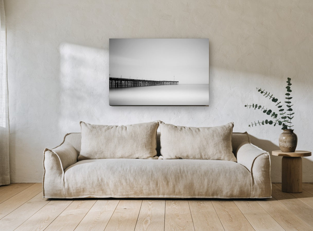 Pier in the Mist coastal canvas print on the wall of a living room
