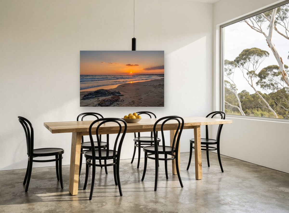 Footprints at Sunset Shore coastal canvas print on the wall of a dining room
