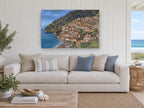 Positano Hillside Village coastal canvas print on the wall of a beach house living room