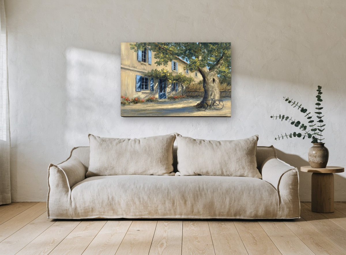 Shaded Courtyard Bicycle floral canvas print on the wall of a living room