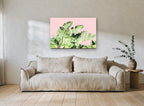 Blush Banana Fronds floral canvas print on the wall of a living room