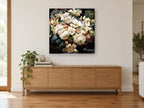 Cream Bouquet at Dusk floral canvas print on the wall of a living room above a sideboard