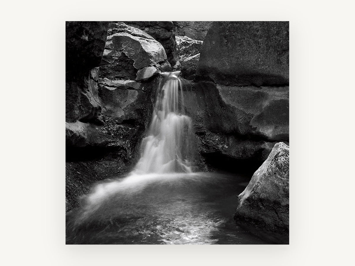 Hushed Rock Cascade, black and white waterfall photograph, landscape canvas wall art print, front view