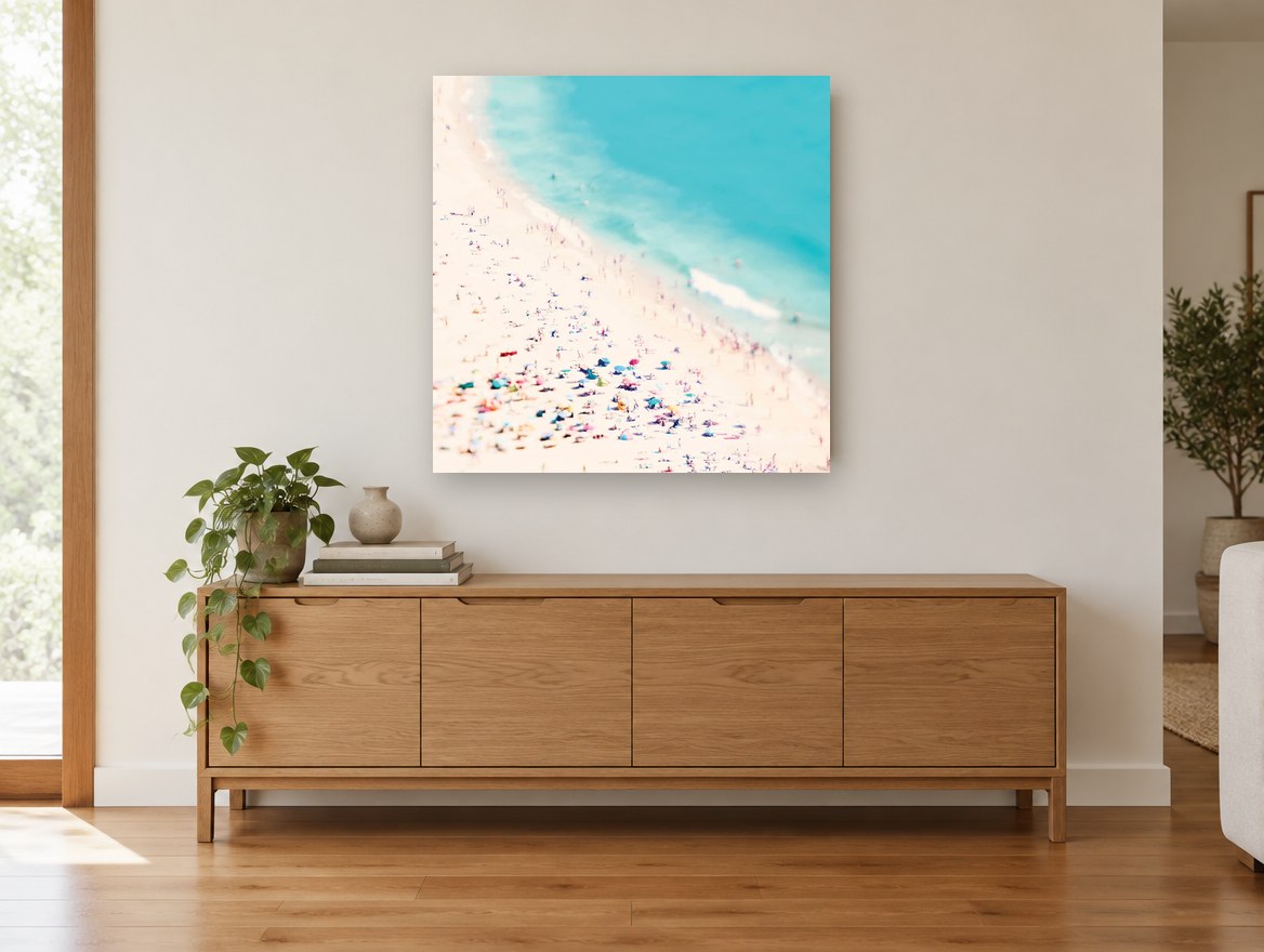 Crowded Shore Day coastal canvas print on the wall of a living room above a sideboard