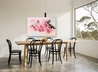 Blush Apple Blossom Branch floral canvas print on the wall of a dining room