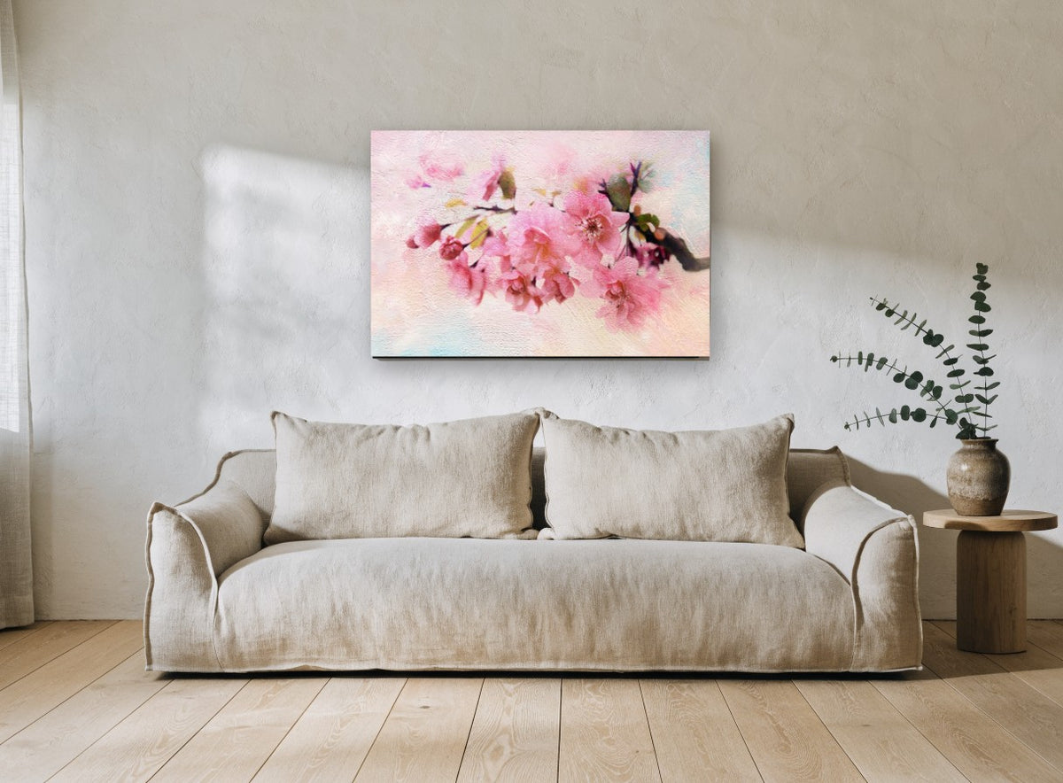 Blush Apple Blossom Branch floral canvas print on the wall of a living room
