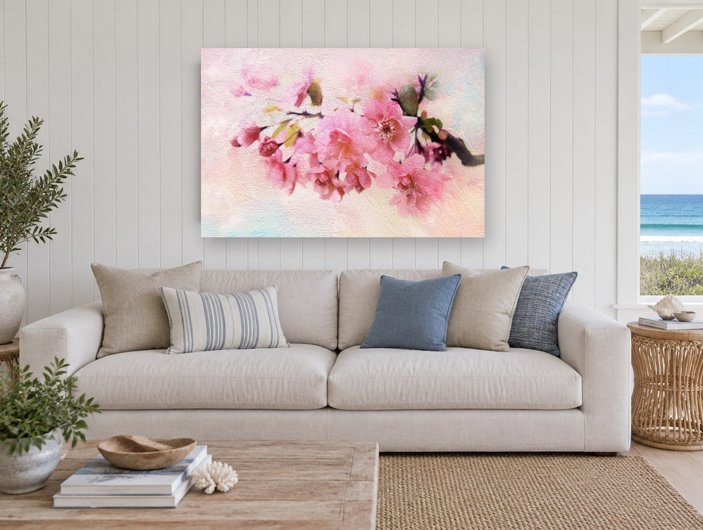 Blush Apple Blossom Branch floral canvas print on the wall of a beach house living room