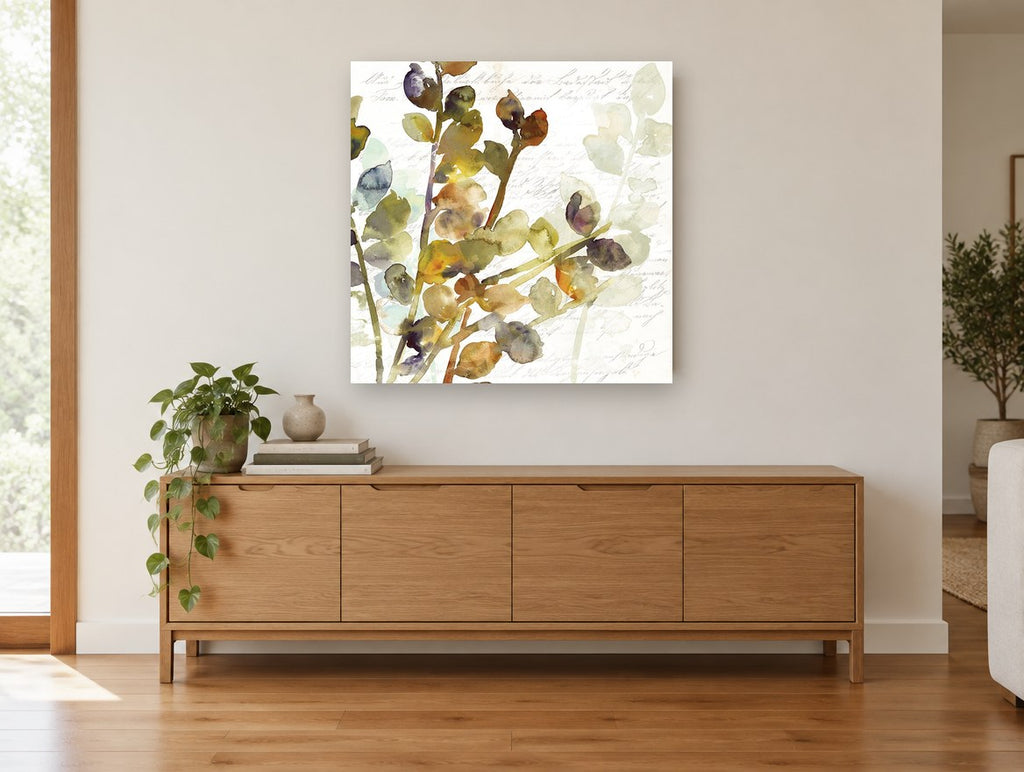 Script and Leaf Sprigs vintage canvas print on the wall of a living room above a sideboard