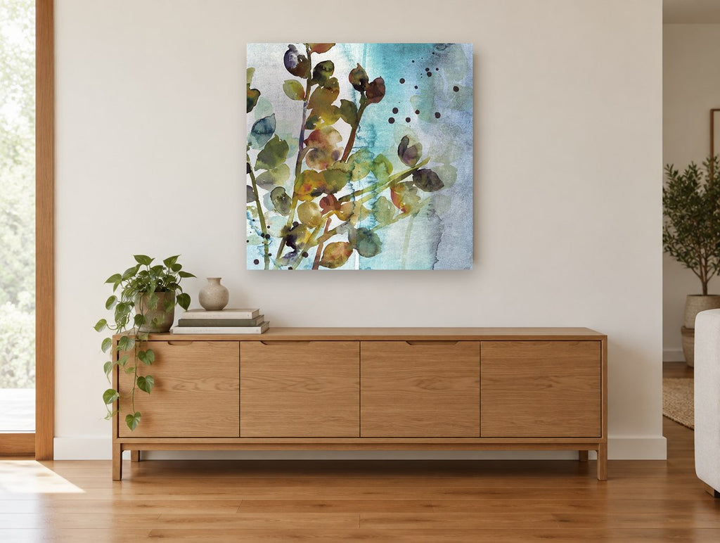 Teal Mist Branches floral canvas print on the wall of a living room above a sideboard
