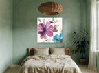 Plum and Teal Blooms floral canvas print on the wall of a bedroom