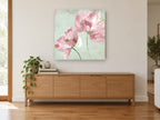 Blush Peonies on Script vintage canvas print on the wall of a living room above a sideboard