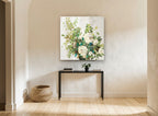 Cream Roses Teal Foliage floral canvas print on the wall of a hallway