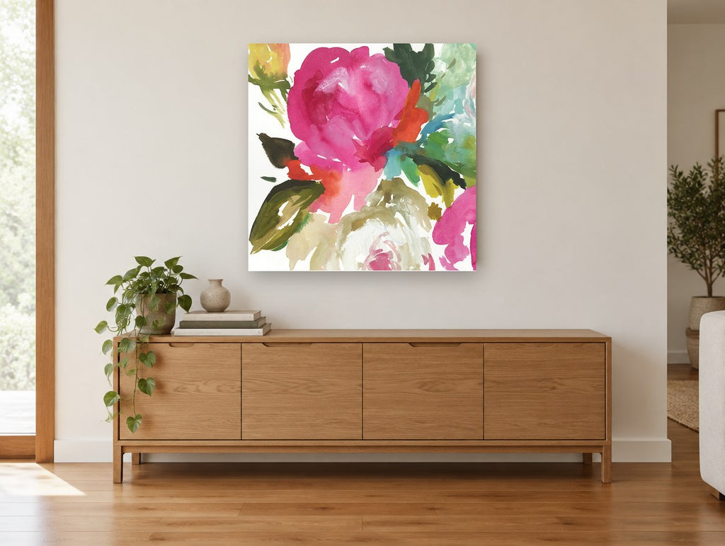 Magenta Bloom Wash floral canvas print on the wall of a living room above a sideboard