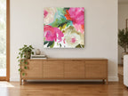 Bright Peony Bouquet floral canvas print on the wall of a living room above a sideboard