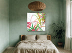 Tropical Fronds Bloom floral canvas print on the wall of a bedroom
