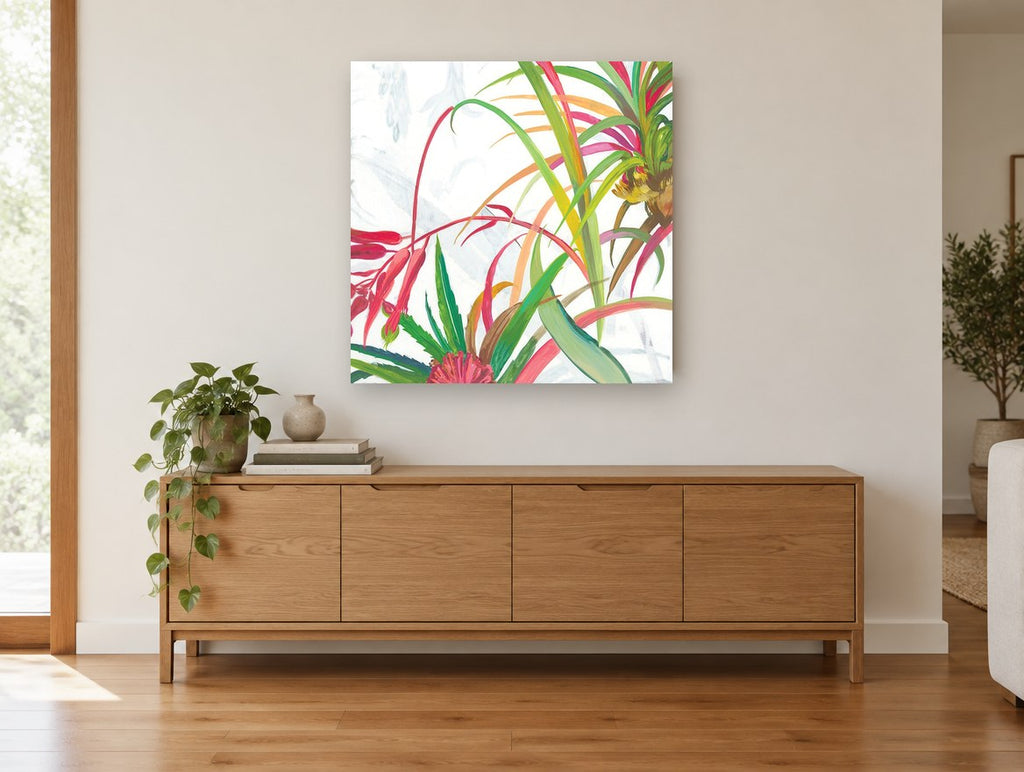 Tropical Fronds Bloom floral canvas print on the wall of a living room above a sideboard
