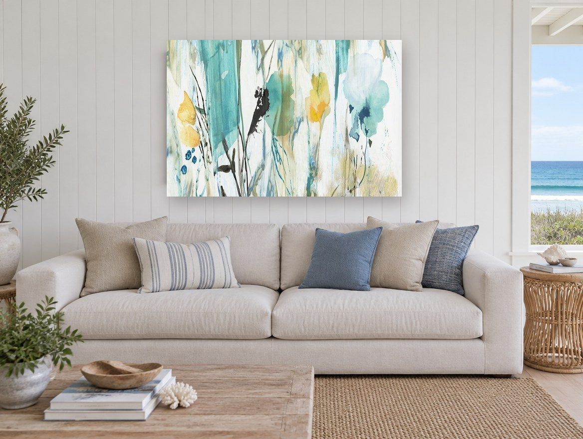 Teal Meadow Wash floral canvas print on the wall of a beach house living room